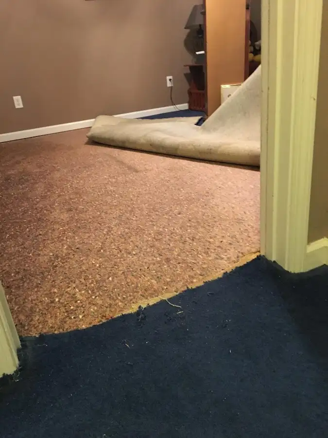 Carpet pad removal revealing water damage during Drying & Dehumidification in Stillwater